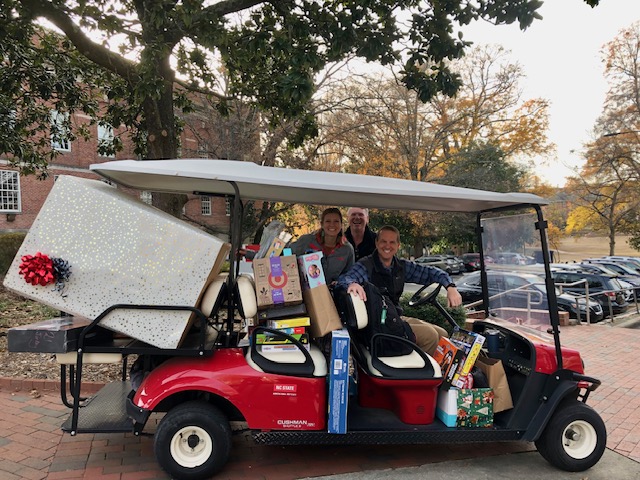 NC State Staff Senators pose with toy donations.