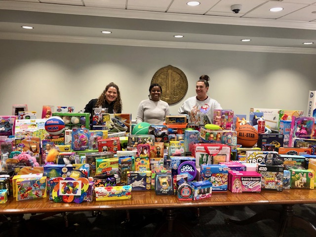 NC State Staff Senators pose with toy donations.