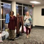 Staff Senators drop off donate items.